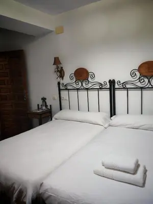 Cama o camas de una habitación en Hostal Casa Inés La Valerosa