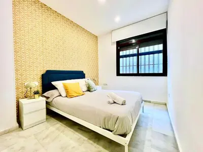 Cama o camas de una habitación en Marcarena downtown Seville