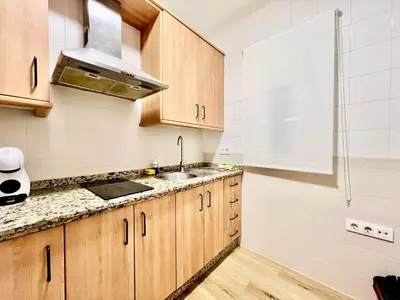 Una cocina o zona de cocina en Marcarena downtown Seville