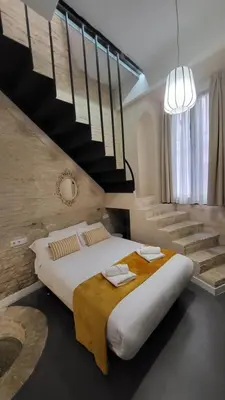 Cama o camas de una habitación en Hogarium Plaza de San Pedro