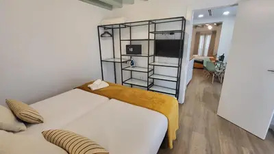 Cama o camas de una habitación en Hogarium Plaza de San Pedro