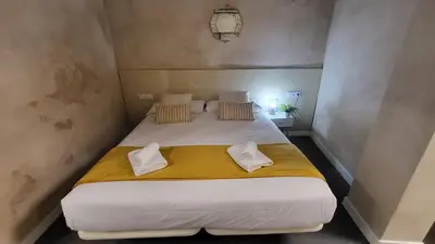 Cama o camas de una habitación en Hogarium Plaza de San Pedro