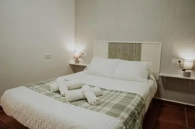 Cama o camas de una habitación en Apartamento La Paloma- Vuela al Caminito del Rey