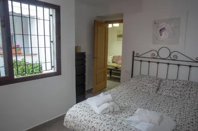 Cama o camas de una habitación en Casa Turística Patio Cordobés - Parking privado en la Judería
