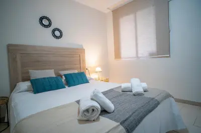 Cama o camas de una habitación en Apartamentos La Piconera