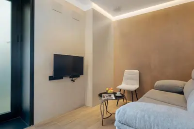 Una televisión o centro de entretenimiento en Panther Home Puerta Osario