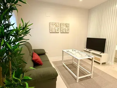 Una televisión o centro de entretenimiento en Almogávares 36 Apartamentos