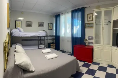 Cama o camas de una habitación en Casa para Grupos en Lucena Piscina Privada y Barbacoa 14 personas