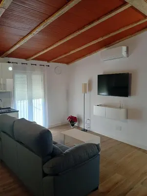 Una televisión o centro de entretenimiento en Apartamento Camino del rey