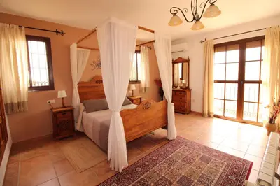 Cama o camas de una habitación en Loma la Parra