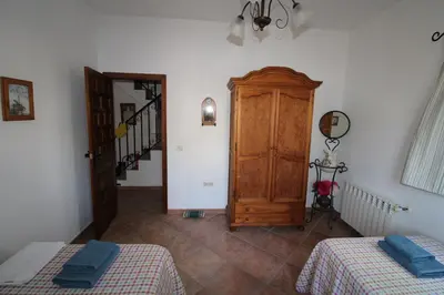 Cama o camas de una habitación en Loma la Parra