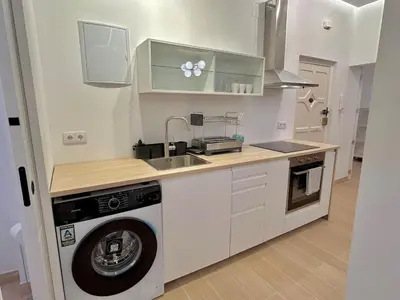 Una cocina o zona de cocina en Acogedor apt 6pax 3Bdr 2Bth - CozyHomeSevilla10
