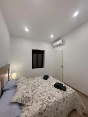 Cama o camas de una habitación en Escápate al centro de Antequera Casa con patio