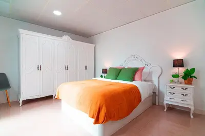 Cama o camas de una habitación en EDomus Esencia Macarena