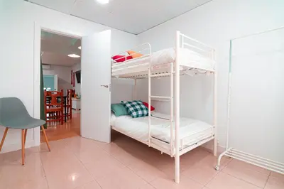 Cama o camas de una habitación en EDomus Esencia Macarena