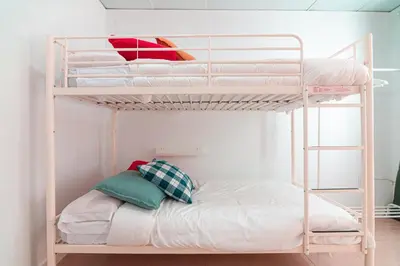 Cama o camas de una habitación en EDomus Esencia Macarena