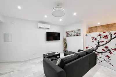 Una televisión o centro de entretenimiento en July Modern Loft