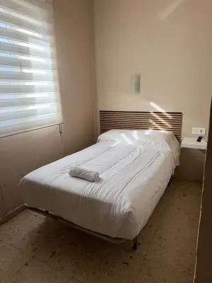 Cama o camas de una habitación en Hostal Alcántara