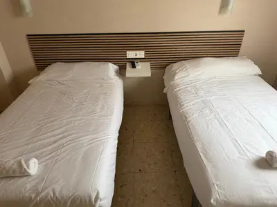 Cama o camas de una habitación en Hostal Alcántara