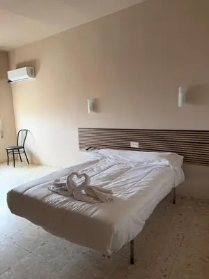 Cama o camas de una habitación en Hostal Alcántara