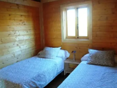 Cama o camas de una habitación en Bungalow confortable avec terrasse - API-1-52-1827