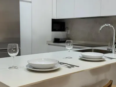Una cocina o zona de cocina en Apartamentos Centro Suites
