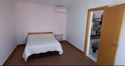 Cama o camas de una habitación en Enjoy Sevilla
