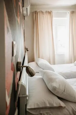 Cama o camas de una habitación en ÁTICO Puerta Almodóvar