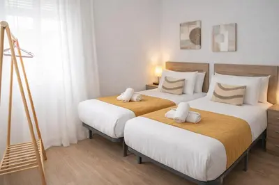 Cama o camas de una habitación en The Felipe II Apartment
