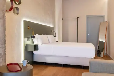 Cama o camas de una habitación en Acueducto Suites Apartments I