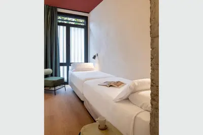 Cama o camas de una habitación en Acueducto Suites Apartments I
