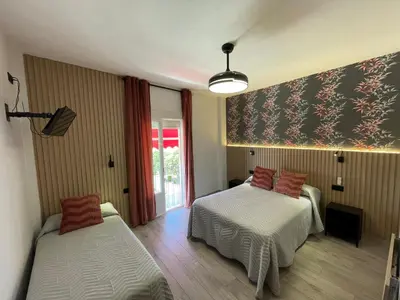 Cama o camas de una habitación en Hostal Calderón de la Barca