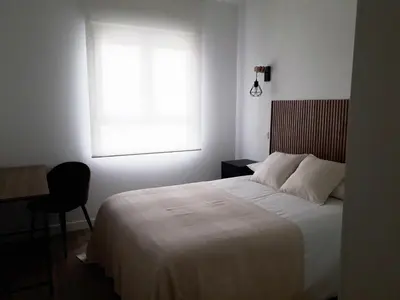 Cama o camas de una habitación en Paseo San Gregorio