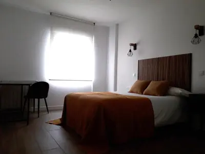 Cama o camas de una habitación en Paseo San Gregorio
