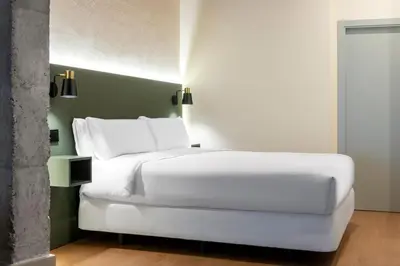 Cama o camas de una habitación en Acueducto Suites Apartments II