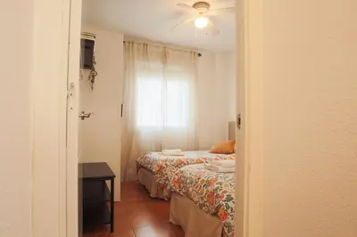 Cama o camas de una habitación en Wish Suite Bulería Sevilla