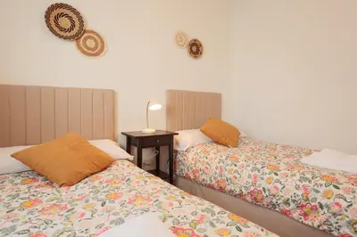 Cama o camas de una habitación en Wish Suite Bulería Sevilla
