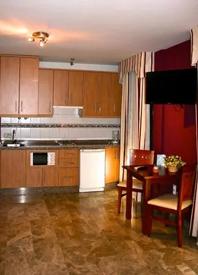 Una cocina o zona de cocina en Apartamentos la Fuente