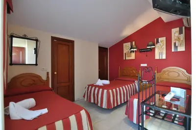 Cama o camas de una habitación en Hostal la Fuente