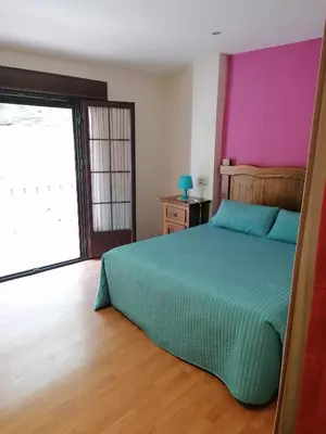 Cama o camas de una habitación en Entrecuevas
