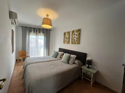 Cama o camas de una habitación en Apartamentos Villa Torcal