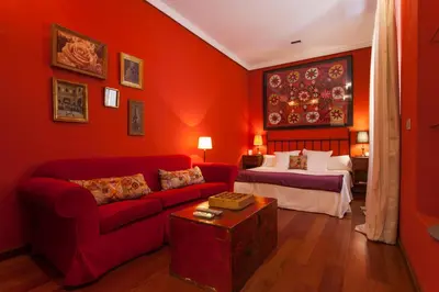 Cama o camas de una habitación en La Casa del Maestro Boutique