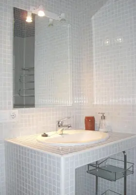 Un baño de Divi Apartments Valvanera