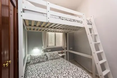 Cama o camas de una habitación en Divi Apartments Valvanera