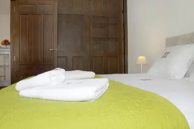 Cama o camas de una habitación en Apartamentos San Fernando 76
