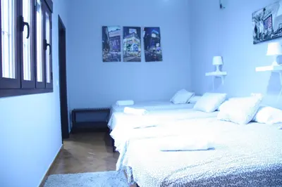 Cama o camas de una habitación en Casa Sevilla Nervión-Centro