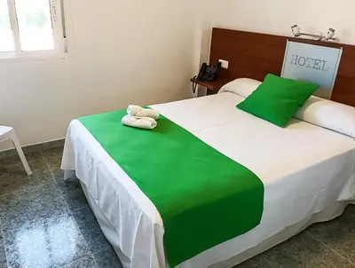 Cama o camas de una habitación en Hacienda Guadalquivir