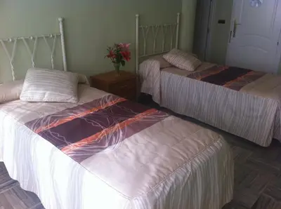 Cama o camas de una habitación en Escudo de Granada
