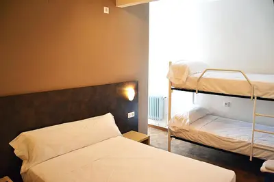 Cama o camas de una habitación en Hostal Restaurante Los Mellizos
