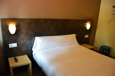 Cama o camas de una habitación en Hostal Restaurante Los Mellizos
